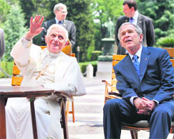 US President George W. Bush listens to Pope Benedict XVI at the Vatican on Friday.
