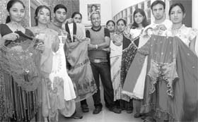 Students of International Institute of Fashion Technology display dresses prepared for the annual fashion show in Mohali