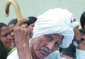 Activists of the BJP Kisan Morcha protest against anti-farmers policy of the Congress-led UPA government and the steep price rise at Parliament Street in New Delhi on Saturday. They demanded the resignation of Prime Minister Dr Manmohan Singh. 
