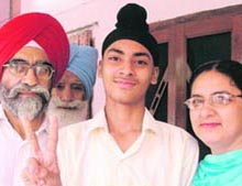 Ishwinder Singh with his parents.