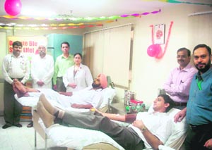 Volunteers donate blood to mark World Blood Donation Day at a local hospital in Ludhiana on Saturday. 