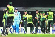 Sohail Tanvir (3R) celebrates the dismissal of Virender Sehwag (L) with his team mates during the final one-day international (ODI) tri-series final at the Sher-e-Bangla Cricket Stadium in Dhaka on Saturday. 