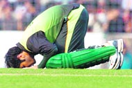Pakistan opener Salman Butt touches the ground after scoring a century