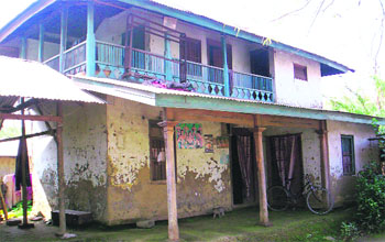 Abung and Nanao stay alone in their double-storey mud-and-wood house. Photos: WFS