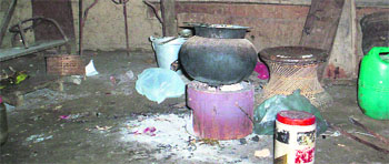 Abung has to take turns with his elder brother to cook in their bare kitchen