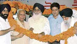 Prakash Singh Badal (centre), Balramji Dass Tandon, Rajinder Bhandari and Capt Kanwaljit Singh during an Akali-BJP joint rally at Zirakpur on Sunday.