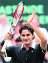 Roger Federer of Switzerland celebrates after defeating Philipp Kohlschreiber of Germany to win the final of the Halle Open ATP tennis tournament in Halle on Sunday.  Reuters