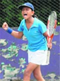 Vineeta of Delhi reacts after scoring a point during AITA Talents Series at CLTA in Chandigarh