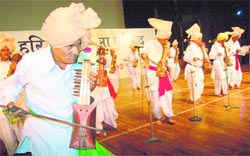 Artistes perform during a state-level folk music festival at Inderdhanush Stadium in Panchkula