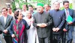 Congress leaders come out of the Governor House after submitting a memorandum on oil price hike, in Shimla
