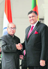 External affairs minister Pranab Mukherjee greets his Sri Lankan counterpart Rohitha Bogollagama before a meeting at Hyderabad House in New Delhi on Monday.