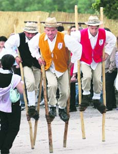 Villagers dressed in traditional clothes race on stilts through the Marche region of Schieti town in Italy