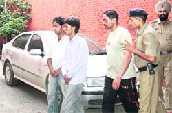 Sukhwinder (extreme right) and two more held for the theft in Krishna Autos, Chandigarh, on Tuesday. 