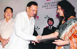 B.D. Dhalia shakes hands with Pallavi Jha after signing the MoU between CDCL, Chandigarh, and Walchand Talent First and Dale Carnegie Training, US, in Chandigarh on Tuesday.