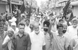 The shopkeepers hold a dharna in Ambala on Tuesday. 