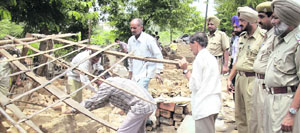 A demolition drive in progress near Rockman factory in Ludhiana on Tuesday.