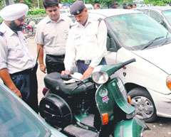 A challaning drive being carried out in Sector 20, Gurdwara Road, Chandigarh, on Wednesday.