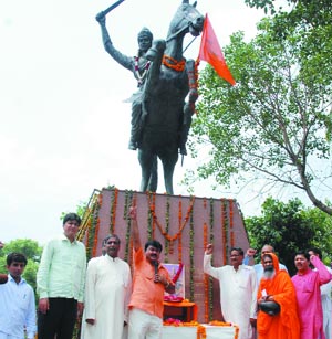Members of the Rashtriya Kavi Sangam celebrate the 151st death anniversary of Rani Lakshmibai at Jhandewalan Chowk in New Delhi on Wednesday. 