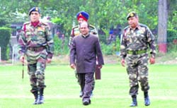 Indias Defence Minister A.K. Antony(c) arrives at Baramulla, about 60 km northwest of Srinagar