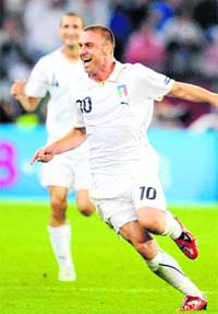 On the right is Italy's second scorer Daniele De Rossi