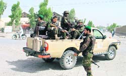 Afghan army soldiers patrol in the southern city of Kandahar