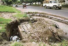 Roads separating Sectors 48 and 49, and (right) Sector 46 and 47 in Chandigarh are in urgent need of repairs.