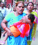 File photograph of a woman with her child at the LNJP Hospital.