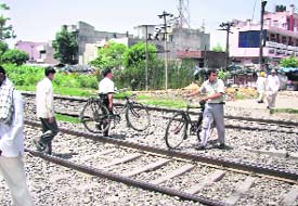 DANGER ZONE: The abandoned railway crossing near Aggarsain chowk gives liberty to the commuters to cross the tracks at will.