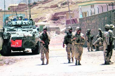 Canadian soldiers from the NATO-led International Security Assistance Force patrol the outskirts of Kandahar on Thursday.  Reuters photo
