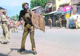 Policemen clashing with demonstrators who were protesting against human rights violations in the Kashmir valley in Srinagar