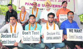 Students and teachers sit on chain fast at PU in Chandigarh on Saturday.