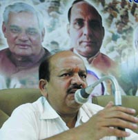 Delhi BJP president Harsh Vardhan addresses a press conference in New Delhi on Saturday. 
