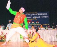 Artistes perform a musical drama during a state-level conference on women empowerment and female foeticide in Karnal on Saturday. 