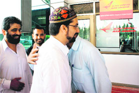 Mirwaiz Umar Farooq, Hurriyat Conference chairman, hugs senior Hurriyat leaders before leaving for Pakistan at the Srinagar Airport on Saturday.