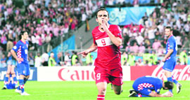 Turkish forward Semih Senturk celebrates after scoring the last-minute equaliser against Croatia on Friday at Ernst Happel Stadium in Vienna. Turkey won 3-1 on penalties.