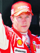 Raikkonen celebrates after taking pole position.