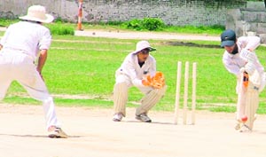 A Ludhiana U-19 Probables batsman plays a shot in a practice match against Ludhiana Seniors XI on SD Govt College grounds in Ludhiana on Sunday.