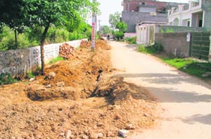 The private sewerline that has been dug up by residents of Aman Park in Ludhiana. 