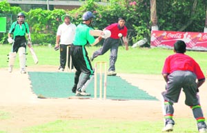 A match in progress between Madhya Pradesh and Haryana on the opening day of the first Senior National 20 Cricket Tournament on PAU campus grounds in Ludhiana on Sunday.