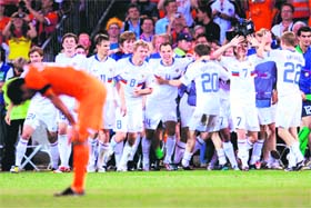 Russian players celebrate in front of Dutch forward Ruud van Nistelrooy (L) at the end of their quarterfinal match against the Netherlands at St. Jakob-Park in Basel
