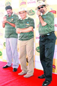The 1983 World Cup winning team members Kapil Dev, Sunil Gavaskar and K Srikkanth during the unveiling of bejewelled cricket bat and ball for auction in London organised at Greater Noida