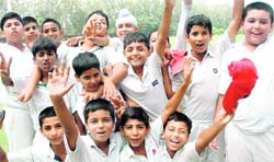 The members of ERCA celebrate after winning the All-India Challenger Trophy Under-12 Cricket Tournament at St Johns, Sector 26, Chandigarh, 