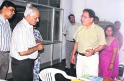 Prof R.C. Sobti (right) discuses a point with DSW Naval Kishore during the inauguration of the guidance cell at PU