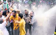 Sidhu being taken away by his supporters after the police used water cannon to disperse the protesters at Matka Chowk in Chandigar