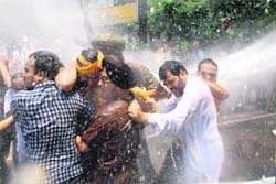 Former Zirakpur MC chief N.K. Sharma (right) shields BJPs Navjot Singh Sidhu during a rally in Chandigarh