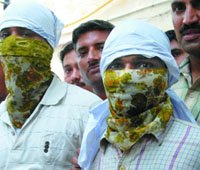 Two members of the Anwar Thakur gang arrested for the murder of Salim Pehalwan in New Delhi on Monday.