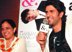 Actor Harman Baweja with his mother Pammi Baweja at a press conference in New Delhi on Monday.