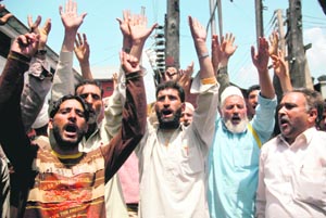 People protest against the killing of Mohammad Ashraf Sheikh at Kokernag village in Srinagar on Monday. 