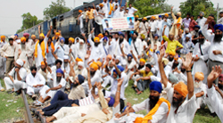 Activists of Khalsa Action Committee block the rail traffic at Rampura Phul