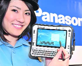 A model displays Matsushita Electric Industrial's heavy-duty handheld PC "Toughbook U1", equipped with Intel's ultra low power consumption Atom processor on its CPU and a 5.6-inch touch-screen LCD display on the shock and water-proof body, in Tokyo